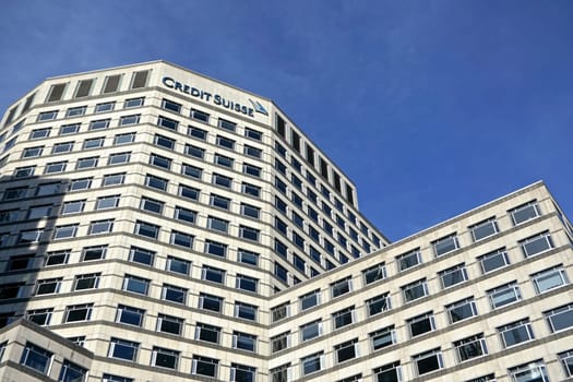 London, United Kingdom - February 03, 2019: Modern offices of UK branch of Credit Suisse at Canary Wharf. CS Group AG is multinational investment bank founded in 1856