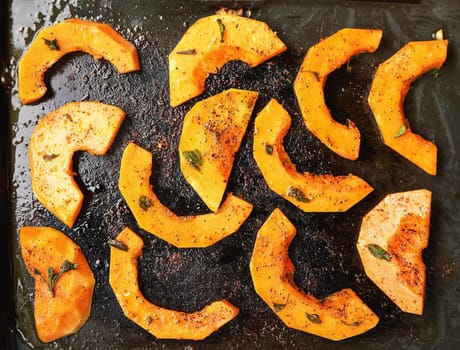 Butternut squash bright orange pieces  grilled on electric grill, view from above