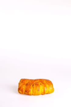 Delicious baked puff pastry with a crispy golden crust, perfect for breakfast, lunch, or a snack. Isolated on a white background.