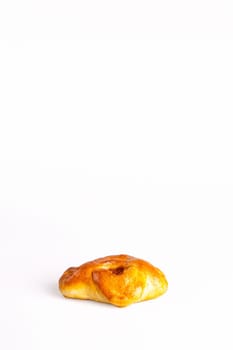 A golden brown meat pie baked to perfection, isolated on a white background. Perfect for your next culinary project.