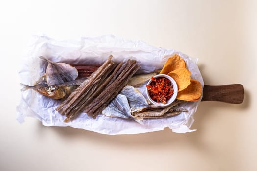 Top view of assorted dry fish for beer. fish on a wooden board.