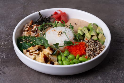 A flavorful mix of textures and flavors with ahi tuna, avocado, cucumber, edamame over rice, topped with sesame seeds and sauce.