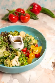 Salad Bowl. Assortment of fresh vegetables, colorful salad, and zesty dressing on a plate. Encouraging a balanced and nutritious diet.