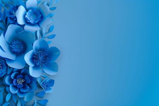 Beautiful delicate background of cut out paper blue flowers located on the left with copy space on the right, flat lay close-up.
