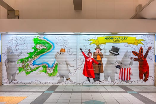 japan, hannō - mar 26 2023: Closed shutter store illustrated of life size costumes characters from Moominvalley Park with Moomintroll, Snork Maiden, Mymble, Snufkin, Moominpappa, Moominmamma or Sniff.