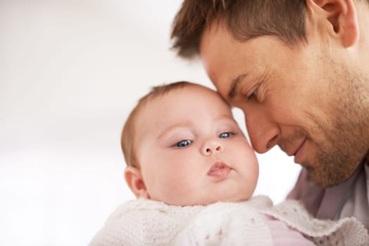 Father, baby and home with hug, support and love together with newborn and smile. Happy, family and dad with young child in a living room with parent care in a house bonding with calm infant.