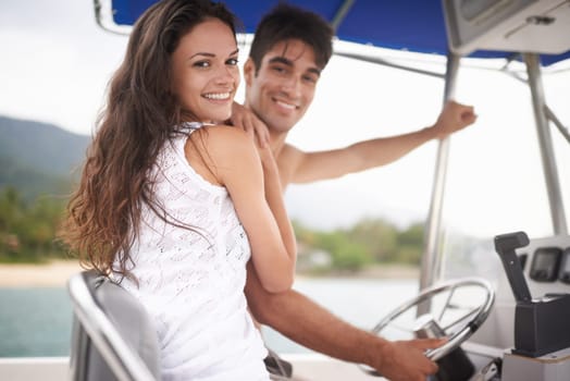 Couple, boat and driving on ocean holiday or explore sea on vacation adventure or sailing, travel or steering wheel. Man, woman and happy in Hawaii or outdoor journey or coast, transportation or trip.