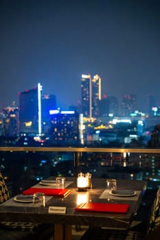 Bangkok skyline view at night from a rooftop restaurant, Bangkok Thailand. High quality photo