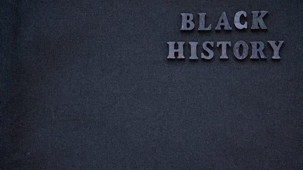 Inscription text Black History Month on dark grey isolated background close up. Celebrating the African American Conceptual Holiday for Equality