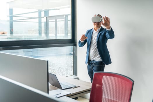 Caucasian mature businessman using mixed reality goggles in the office