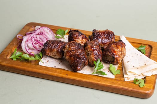 Lamb skewers, a global favorite, made with lamb, chicken, or beef, grilled or roasted, served with diverse dipping sauces, enjoyed worldwide.