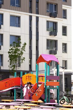 A vibrant playground with colorful equipment for kids, creating a fun and safe environment for families to enjoy together.