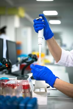 process of working with analyses in the laboratory. hands close-up.