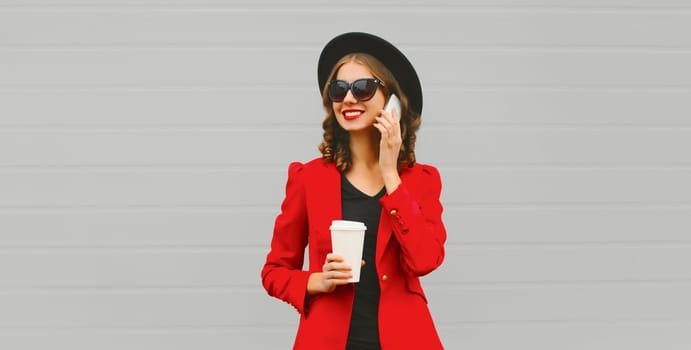 Beautiful lady woman calling on smartphone in red business blazer jacket