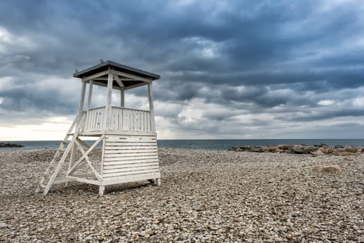 Lifeguard tower on the city beach in the morning before the rain in the resort village of Nebug, Krasnodar Territory, Russia..