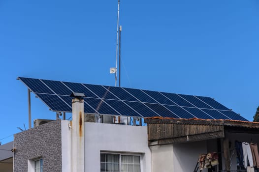 solar panels on the roof of a house in the village