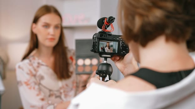 Two influencer partner shoot live streaming vlog video review makeup prim social media or blog. Happy young girl with cosmetics studio lighting for marketing recording session broadcasting online.