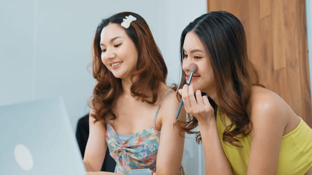 Two influencer partner shoot live streaming vlog video review makeup social media or blog. Happy young girl with vivancy cosmetics studio lighting for marketing recording session broadcasting online.