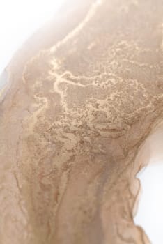 The picture is painted with alcohol ink on a white background. Luxury abstract fluid art technique: bronze, silver, metallic and gold color.