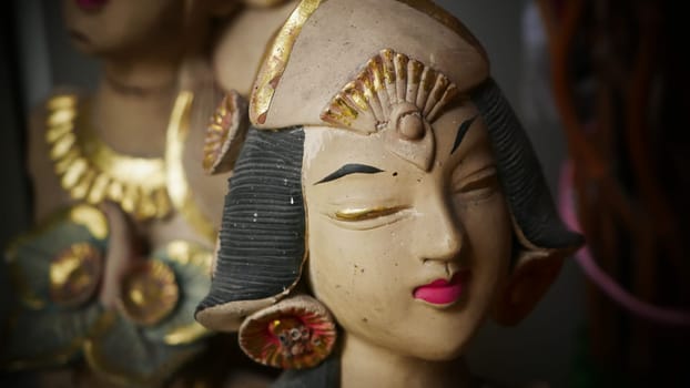 Beautiful artistic statue of a Balinese or javanese dancer used as garden decoration, javanese gnome indonesia asian garden statue