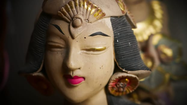 Beautiful artistic statue of a Balinese or javanese dancer used as garden decoration, javanese gnome indonesia asian garden statue