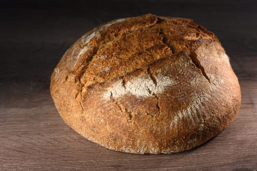 appetizing homemade whole grain bread on a wooden table 7
