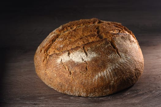 appetizing homemade whole grain bread on a wooden table 8