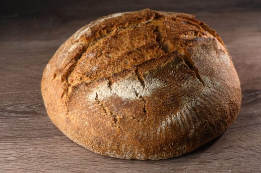 appetizing homemade whole grain bread on a wooden table 9