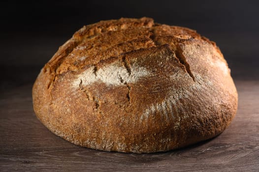 appetizing homemade whole grain bread on a wooden table 10