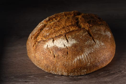 appetizing homemade whole grain bread on a wooden table 11
