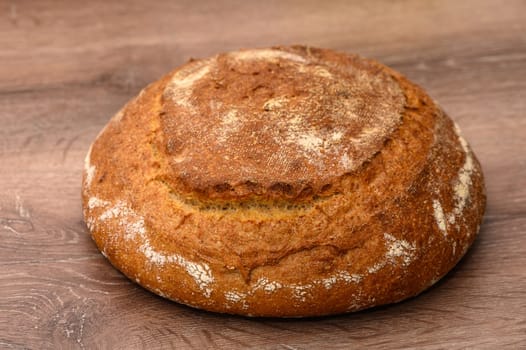 appetizing homemade whole grain bread on a wooden table 2