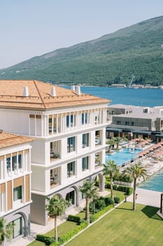 One and Only hotel complex with sun loungers near the pools on the seashore. Portonovi, Montenegro. High quality photo