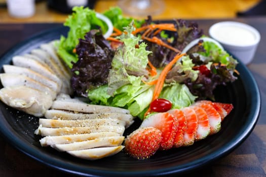 Grilled Chicken Fillet And Fresh Green Leafy Vegetable Salad With Strawberry. Health Food.