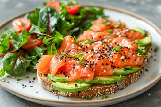 Toast with avocado and salmon on rye bread with black sesame seeds, with chard leaves, on a white plate, on a gray surface. AI generated.
