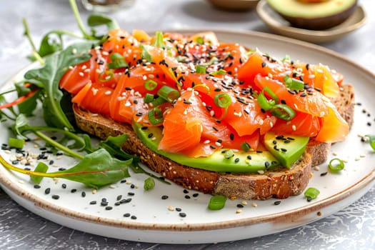 Toast with avocado and salmon on rye bread with black sesame seeds, with chard leaves, on a white plate, on a gray surface. AI generated.