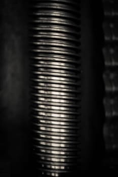 A close-up of metal rod with screw thread