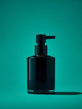 A black bottle of lotion on a green background