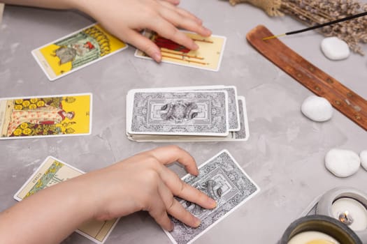 TVER, RUSSIA - FEBRUARY 18, 2024. Tarot cards, Tarot card divination, fortune telling. Occultism, esoteric education