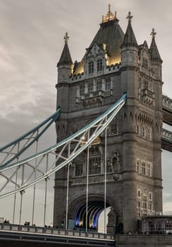 London, UK - Feb 15, 2024 - Beautiful scenery view of famous Tower bridge and skyline with reflections in the river thames just after sunset. The illuminated Tower Bridge, Space for text, Selective focus.