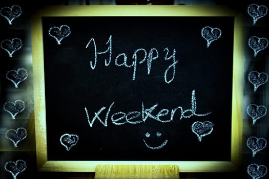 Happy weekend written with chalk. No copy space