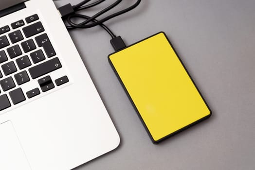 External hard disk connected to laptop. USB drive backup data