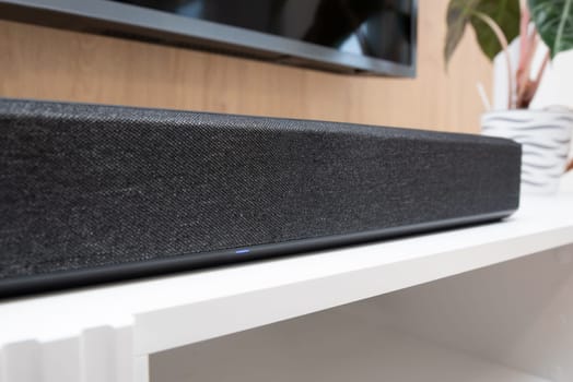 Soundbar in a modern home. Listening to music and watching movies