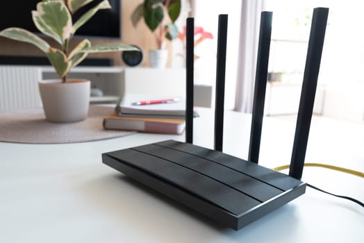 Router with 4 antennas in living room. High speed internet concept