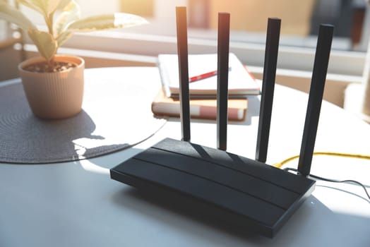 Router with 4 antennas in living room. High speed internet concept