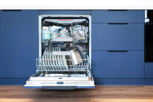 Dishwasher in modern kitchen. Perfectly washing dishes