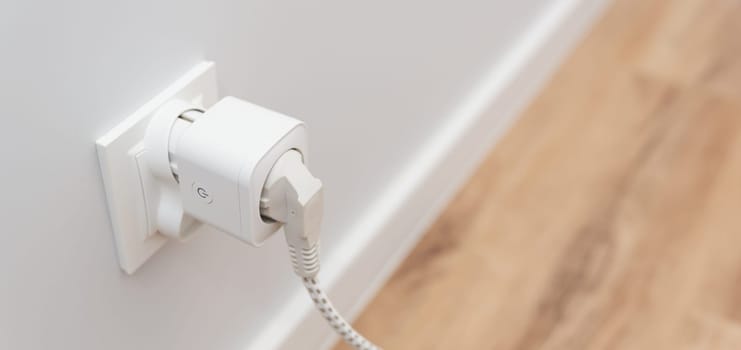 Using Wi-fi smart socket on the wall in a smart home, controlling electricity consumption