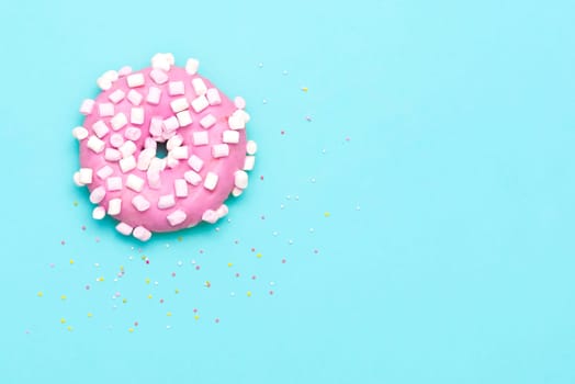 Delicious donut on color background. Mix of flying multicolored doughnuts