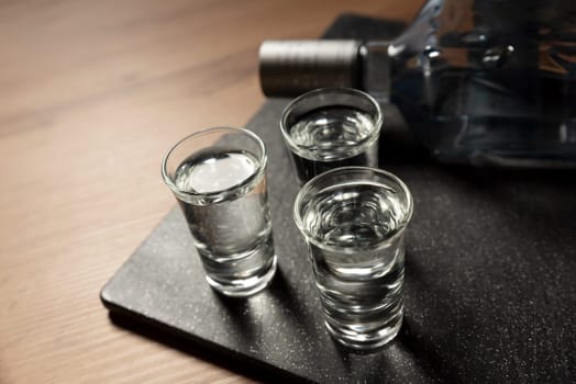 Glasses with vodka on the table. Alcohol closeup