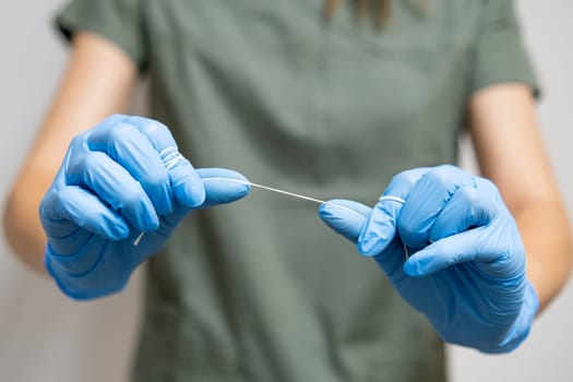 Oral hygiene floss being utilized by a dentist for the cleaning of teeth