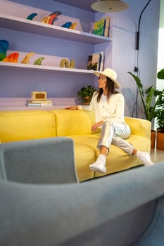 Model with white hat in pastel decoration, spain